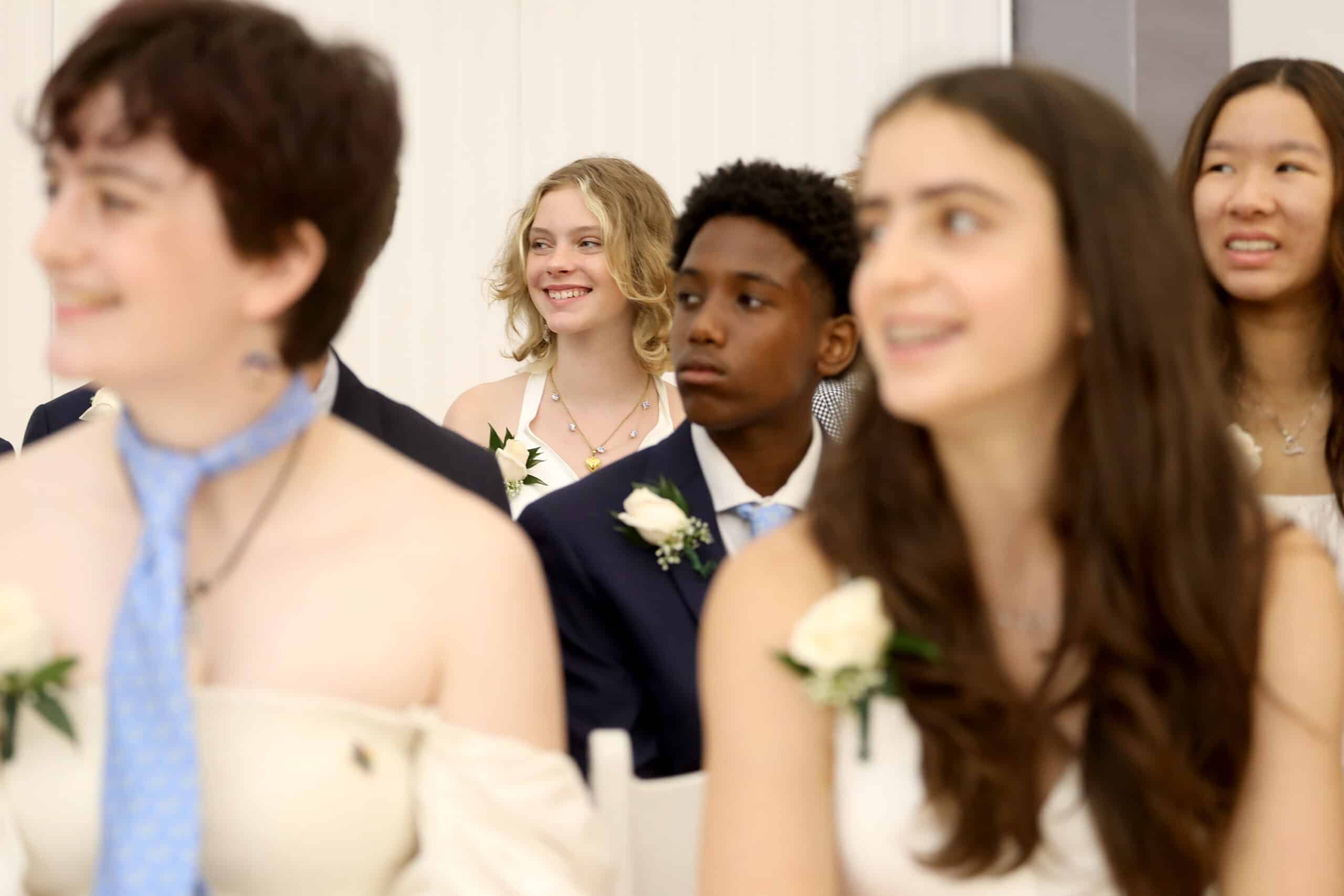 Graduates listen to a speaker at the graduation ceremony